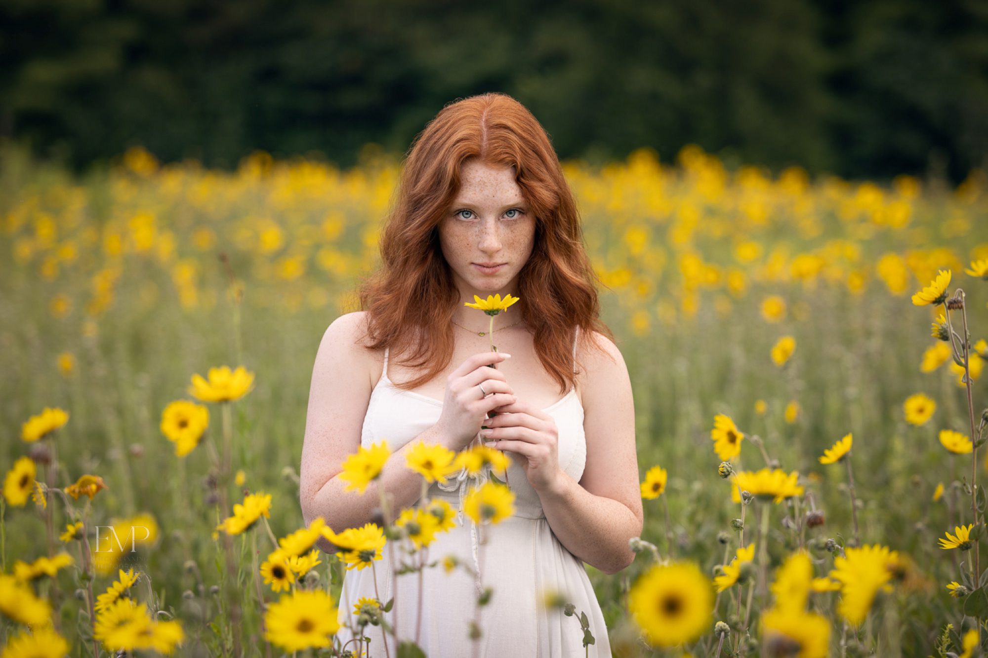 Senior girl in field of flowers 