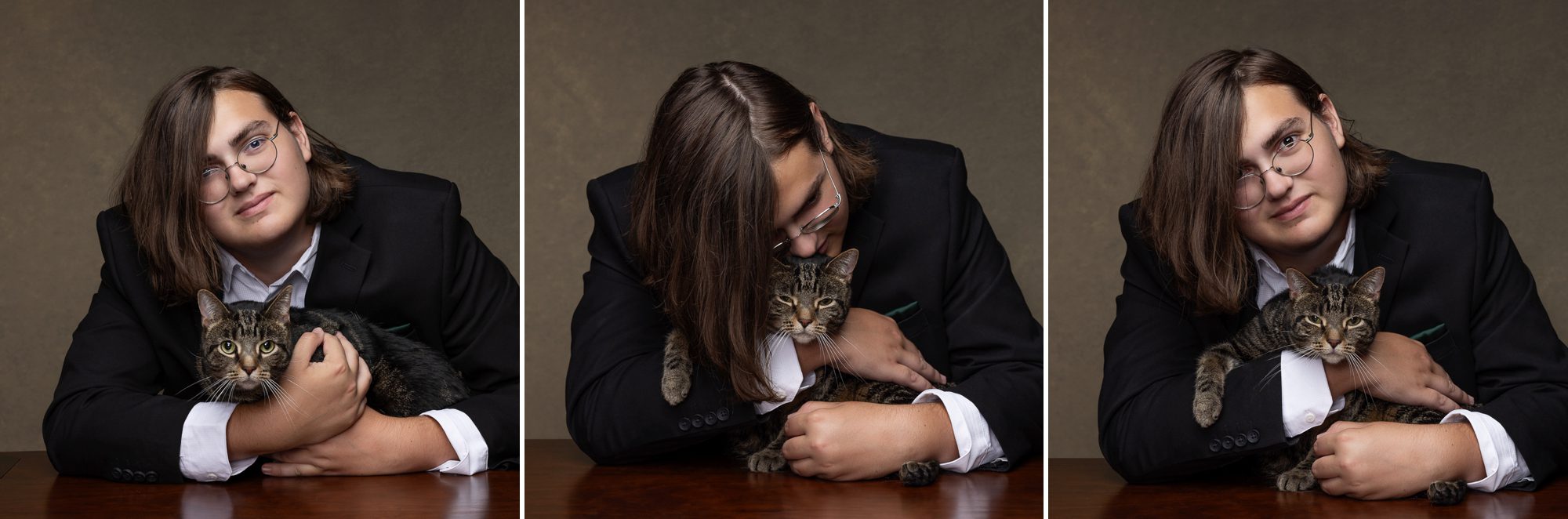High school senior guy in studio with cat