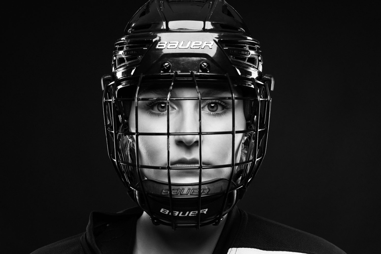 High school senior girl hockey player dramatic portrait