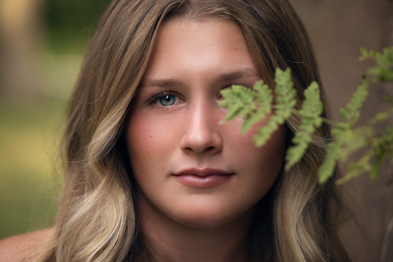 High school girl model creative image with fern leaf