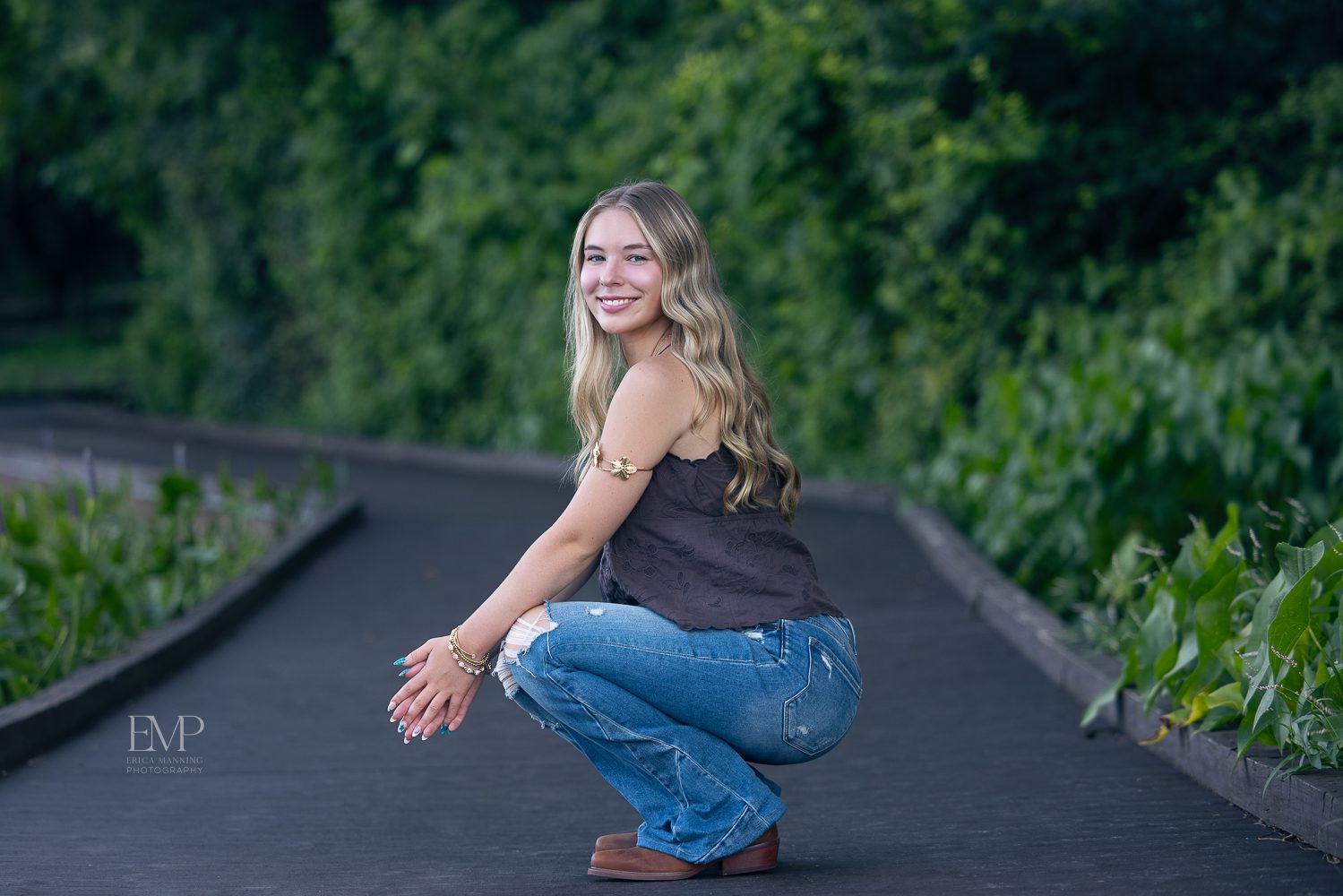 High school senior girl on boardwalk