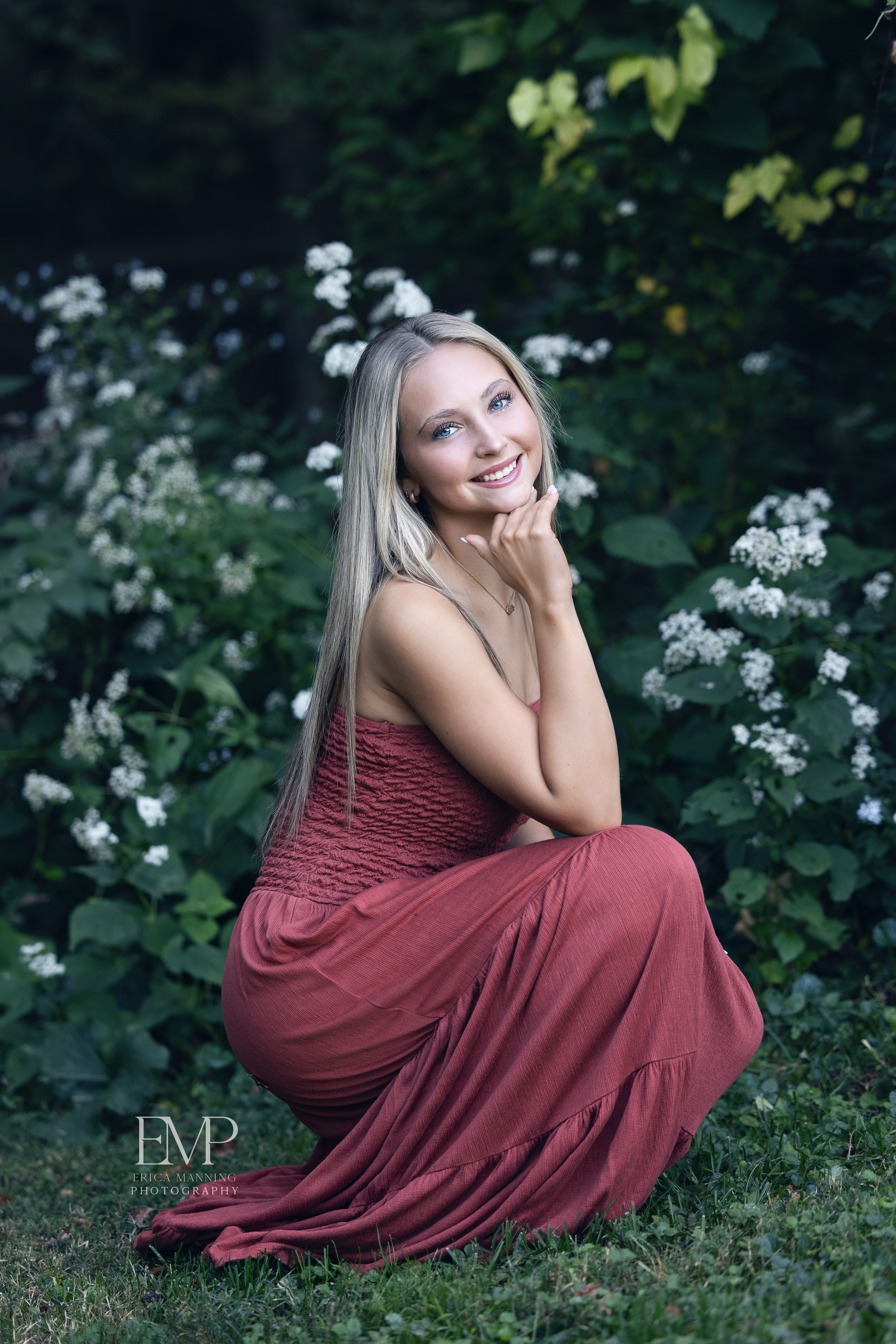 High school senior girl in park wearing dress