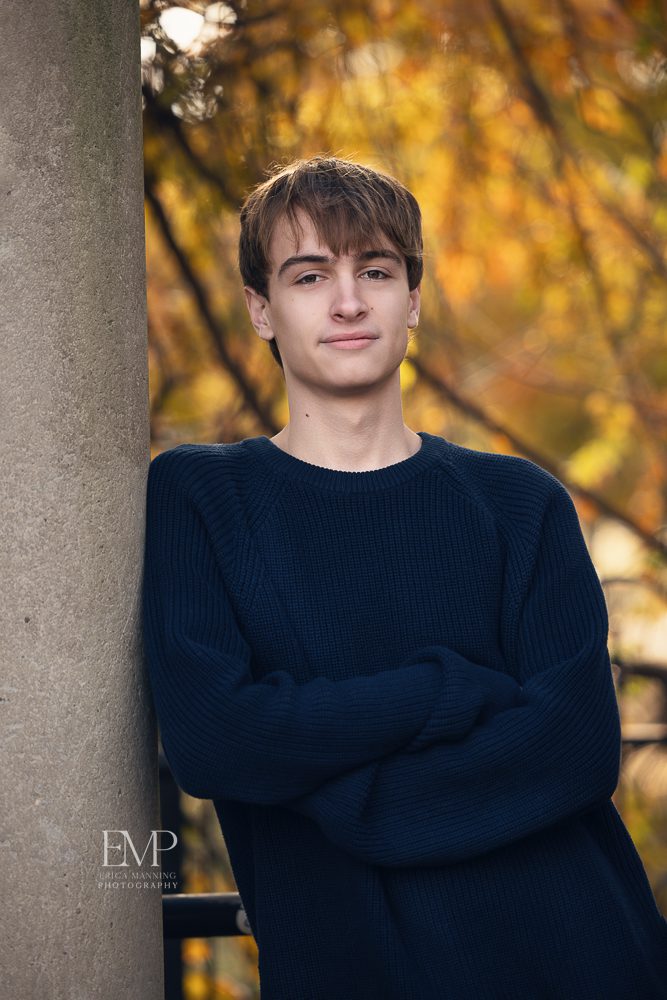 High school senior guy in park in Fall